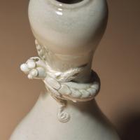 A Chinese White Glazed Porcelain 'Chilong' Bottle Vase, Qing Dynasty — 清 白釉盤螭龍瓶