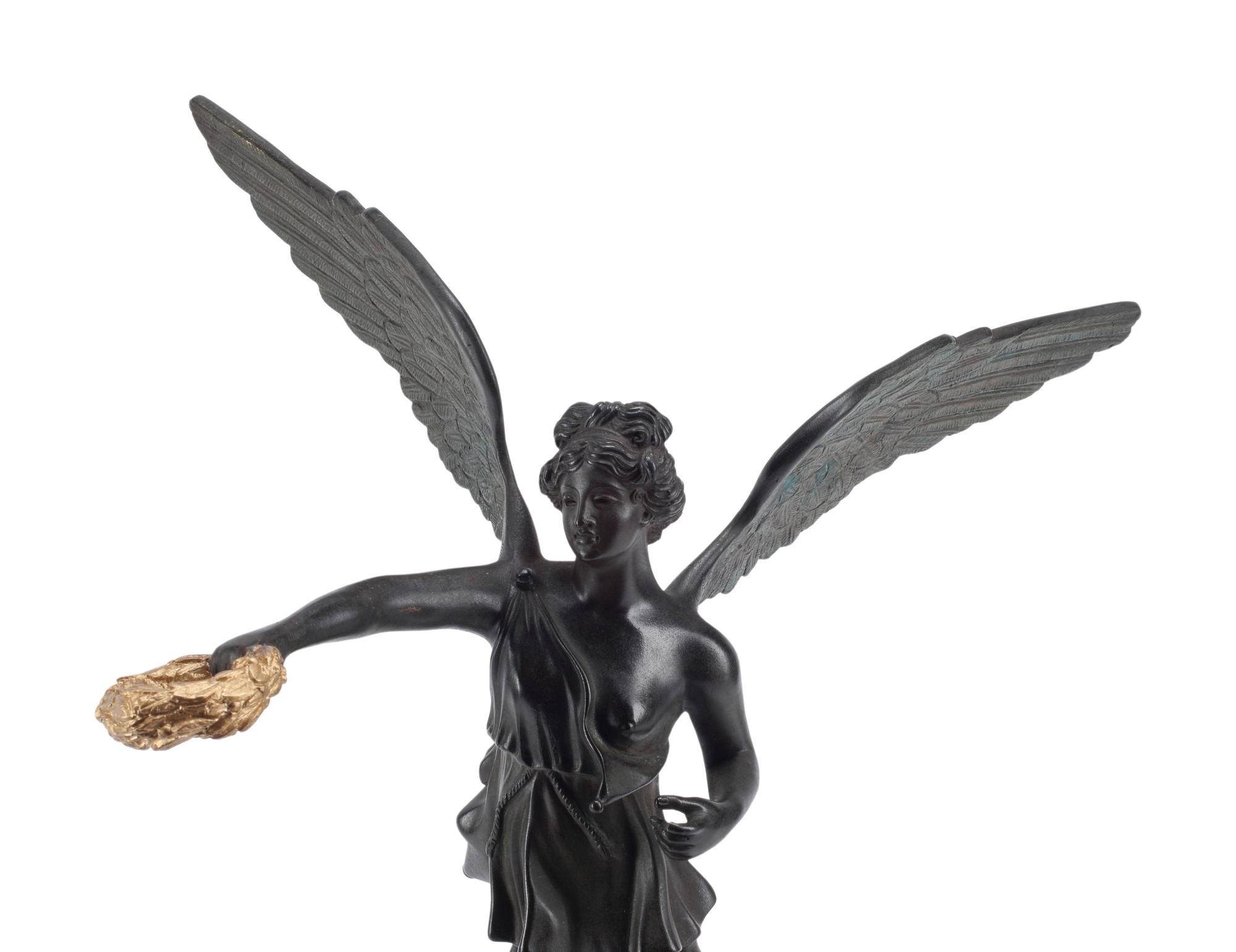 A Patinated and Parcel Gilt Bronze Figure of Winged Liberty