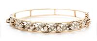 A 14 Karat Yellow Gold and Diamond Bangle Bracelet, 11.40 dwts.