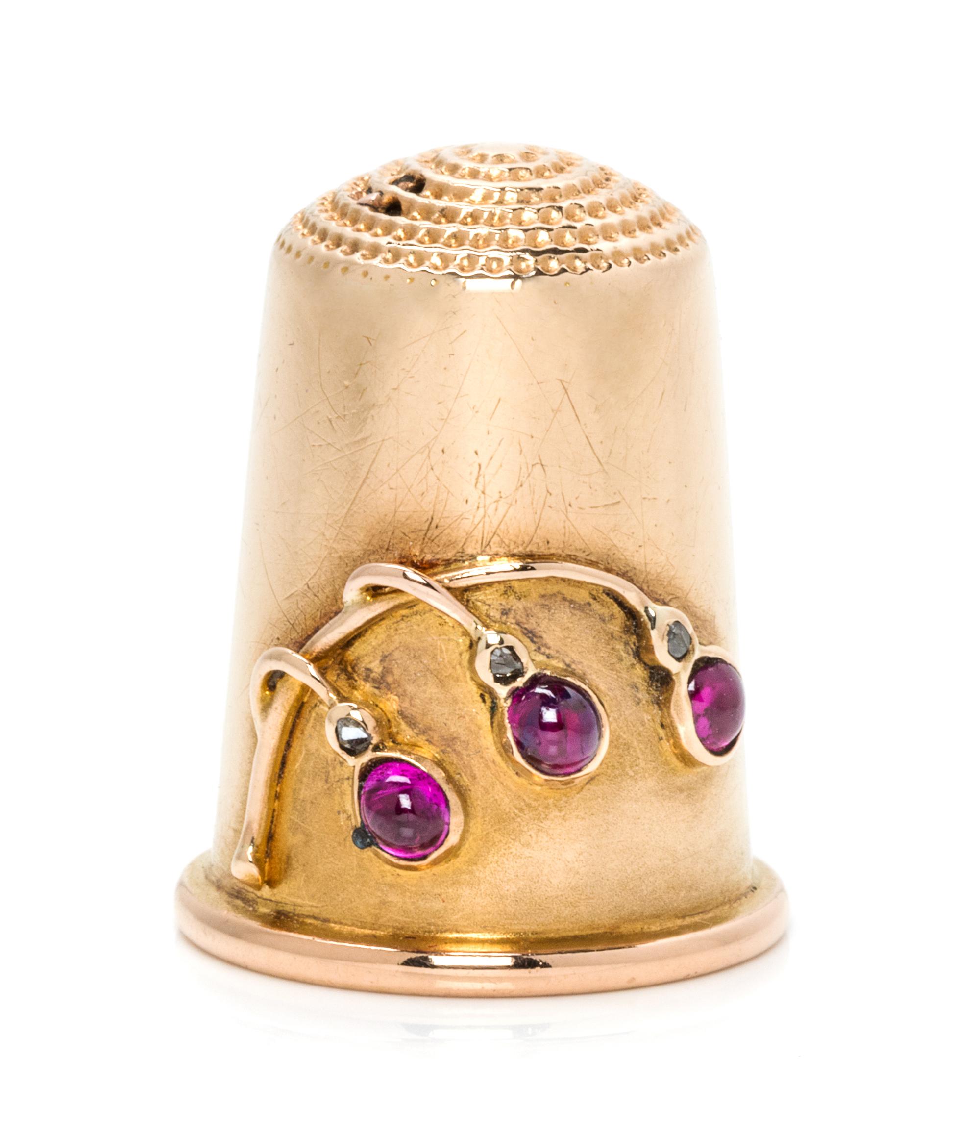 A Russian Gold, Diamond and Ruby Thimble, Maker's Mark of Carl Faberge, St. Petersburg, Late 19th/Early 20th Century, the knurled top a