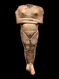 A Cycladic Marble Reclining Female Figure
