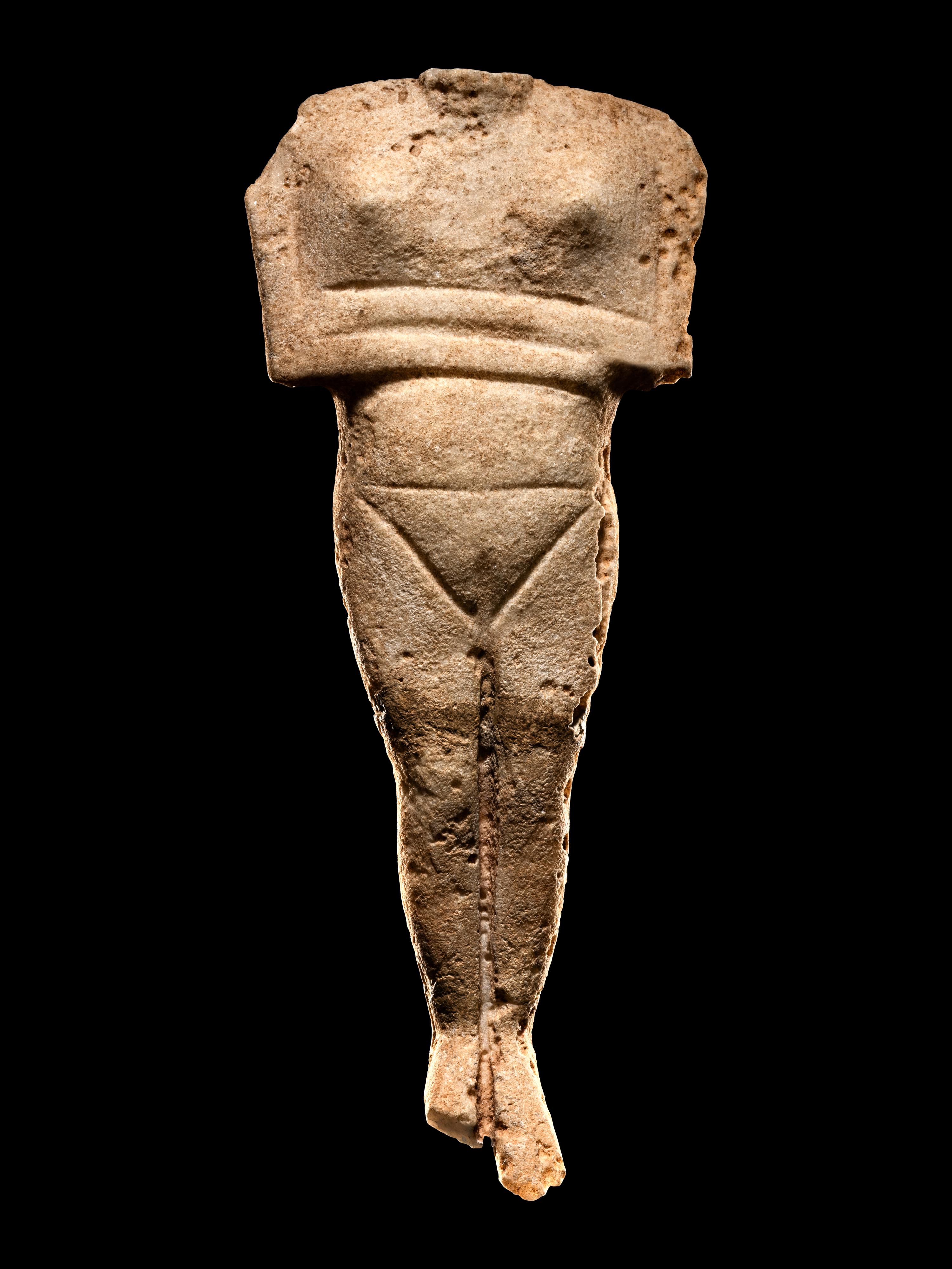 A Cycladic Marble Reclining Female Figure
