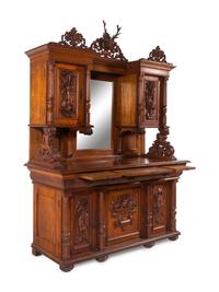 A Black Forest Style Carved Oak Serving Cabinet