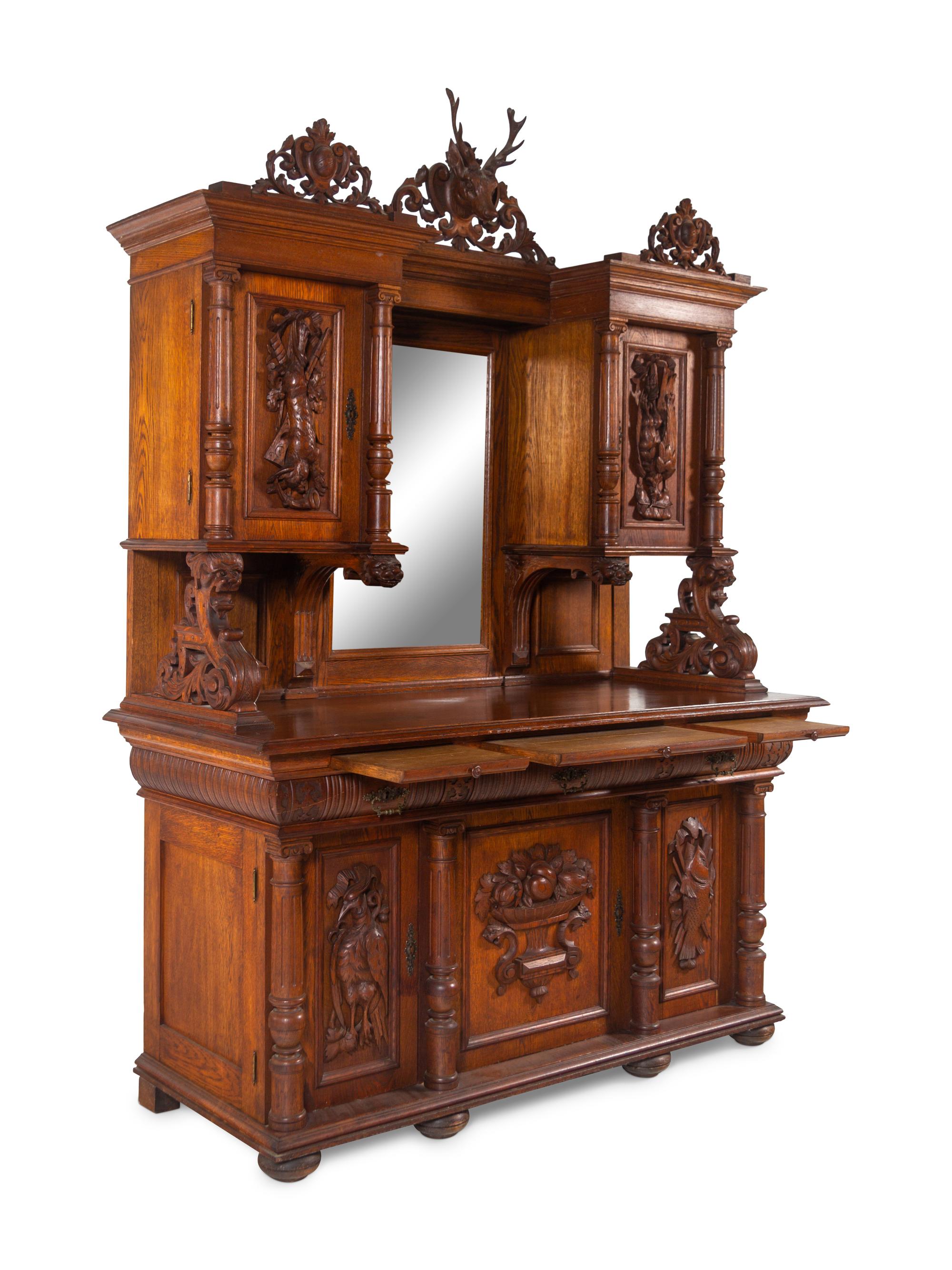 A Black Forest Style Carved Oak Serving Cabinet