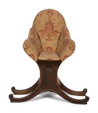 A Venetian Carved Walnut Gondola Chair