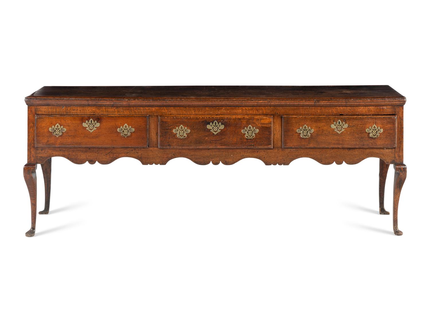 A Provincial Queen Anne Carved Oak Welsh Dresser