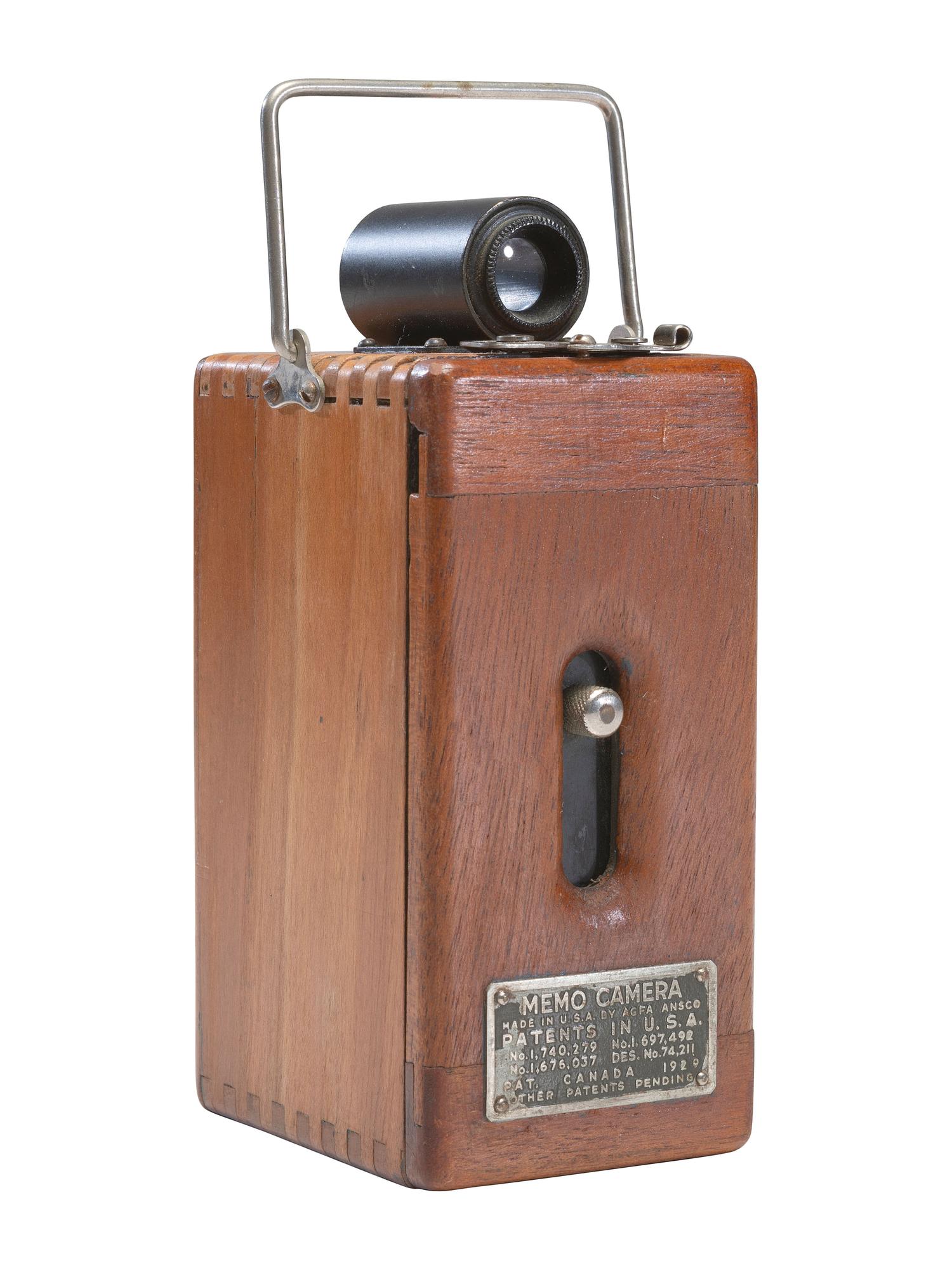[EARLY PHOTOGRAPHY]. Ansco Memo camera with polished wooden body.
