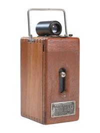 [EARLY PHOTOGRAPHY]. Ansco Memo camera with polished wooden body.