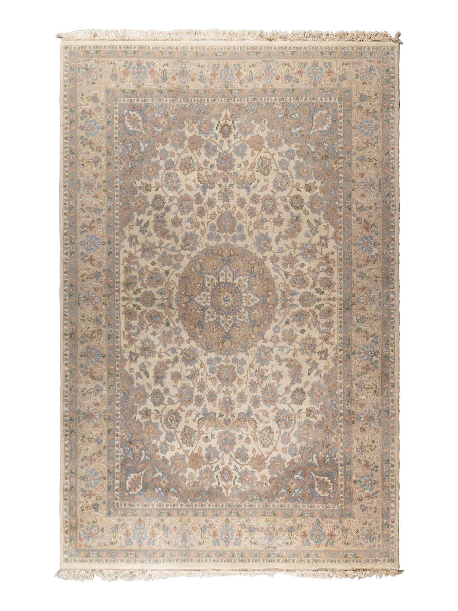 An Ivory and Pastel Rug