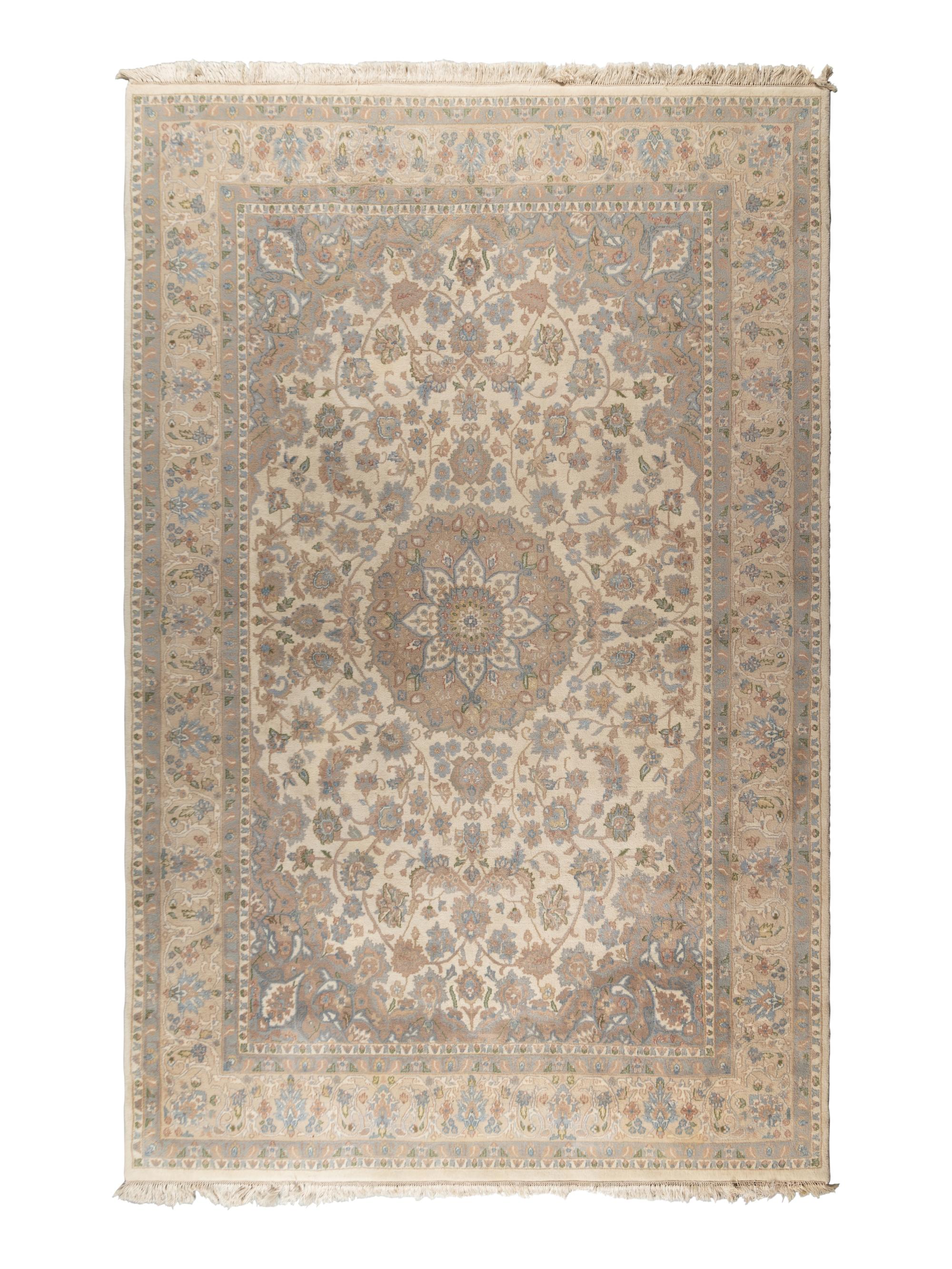An Ivory and Pastel Rug