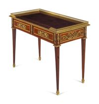 A Louis XVI Style Gilt Bronze Mounted Mahogany Table à Écrire
