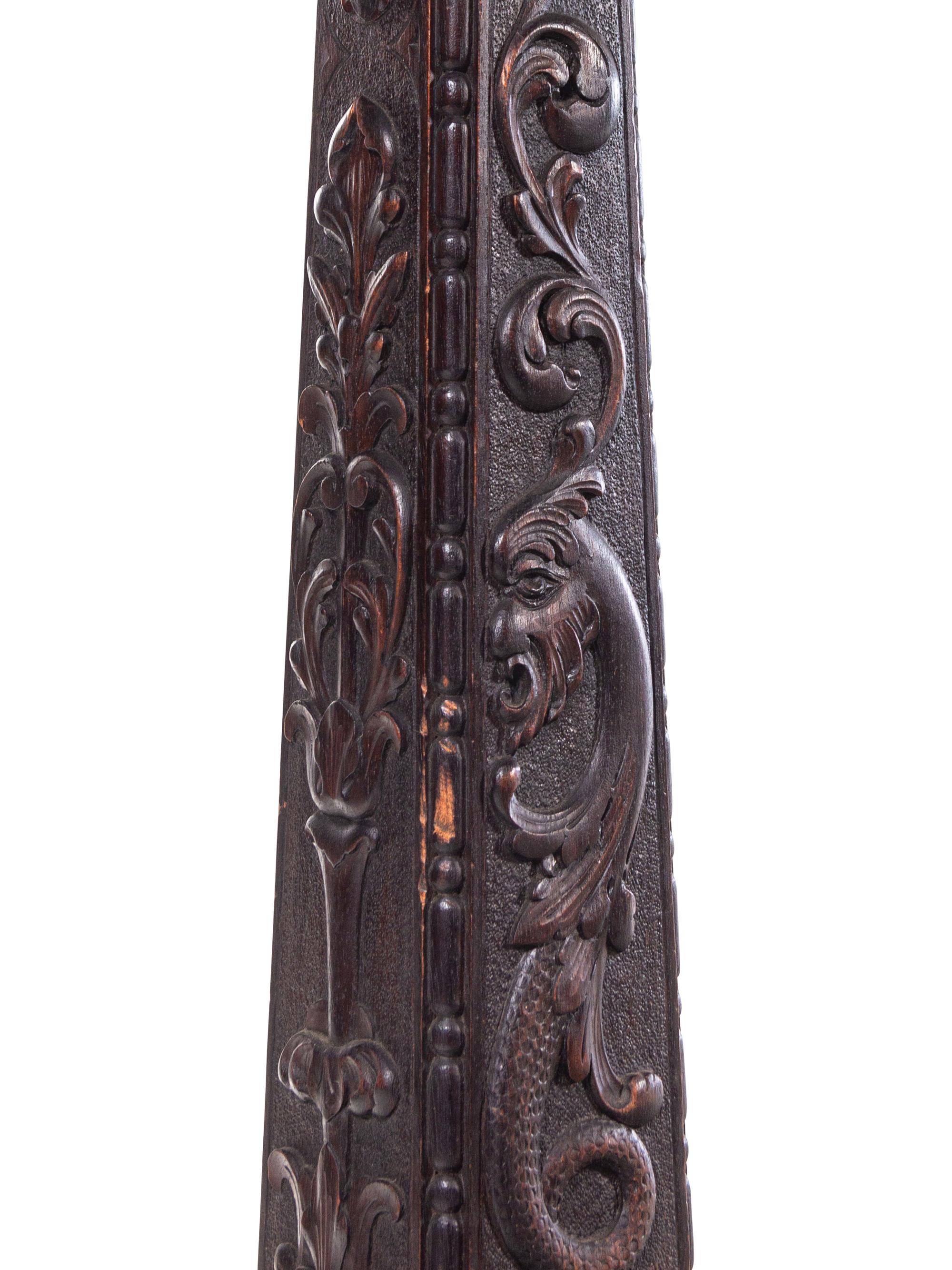 A Carved Mahogany Floor Lamp