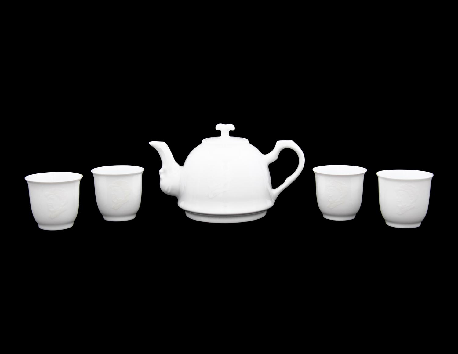 A Set of White Glazed Porcelain Teapot and Tea Cups and A Covered Mug