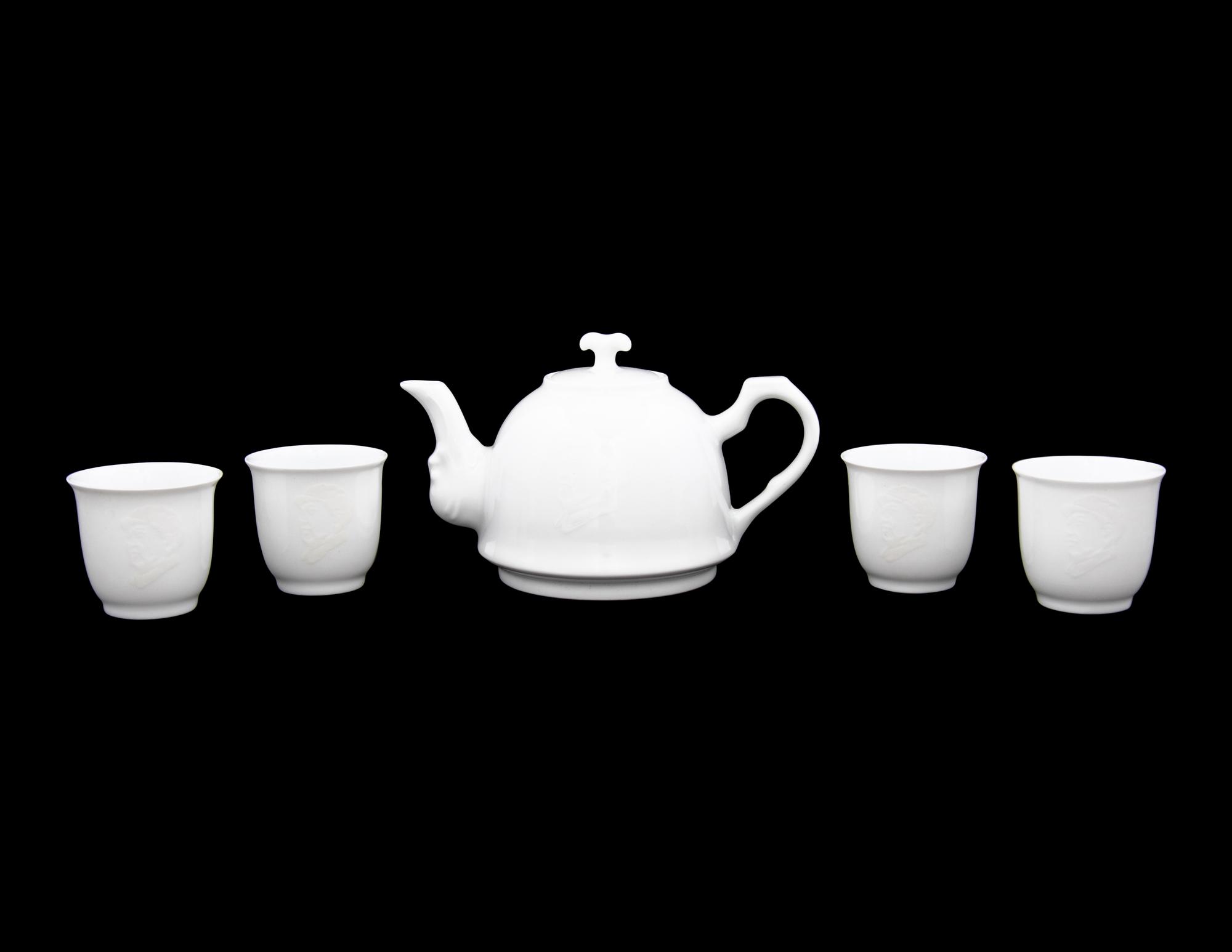 A Set of White Glazed Porcelain Teapot and Tea Cups and A Covered Mug