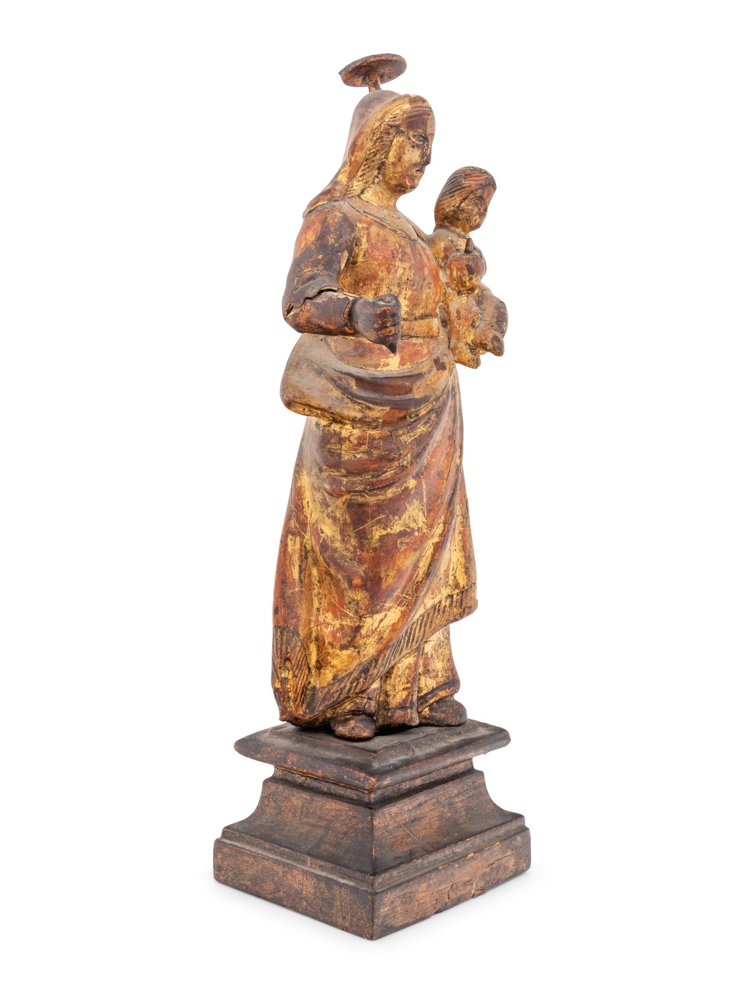 A Continental Carved and Gilt Decorated Santo Figure