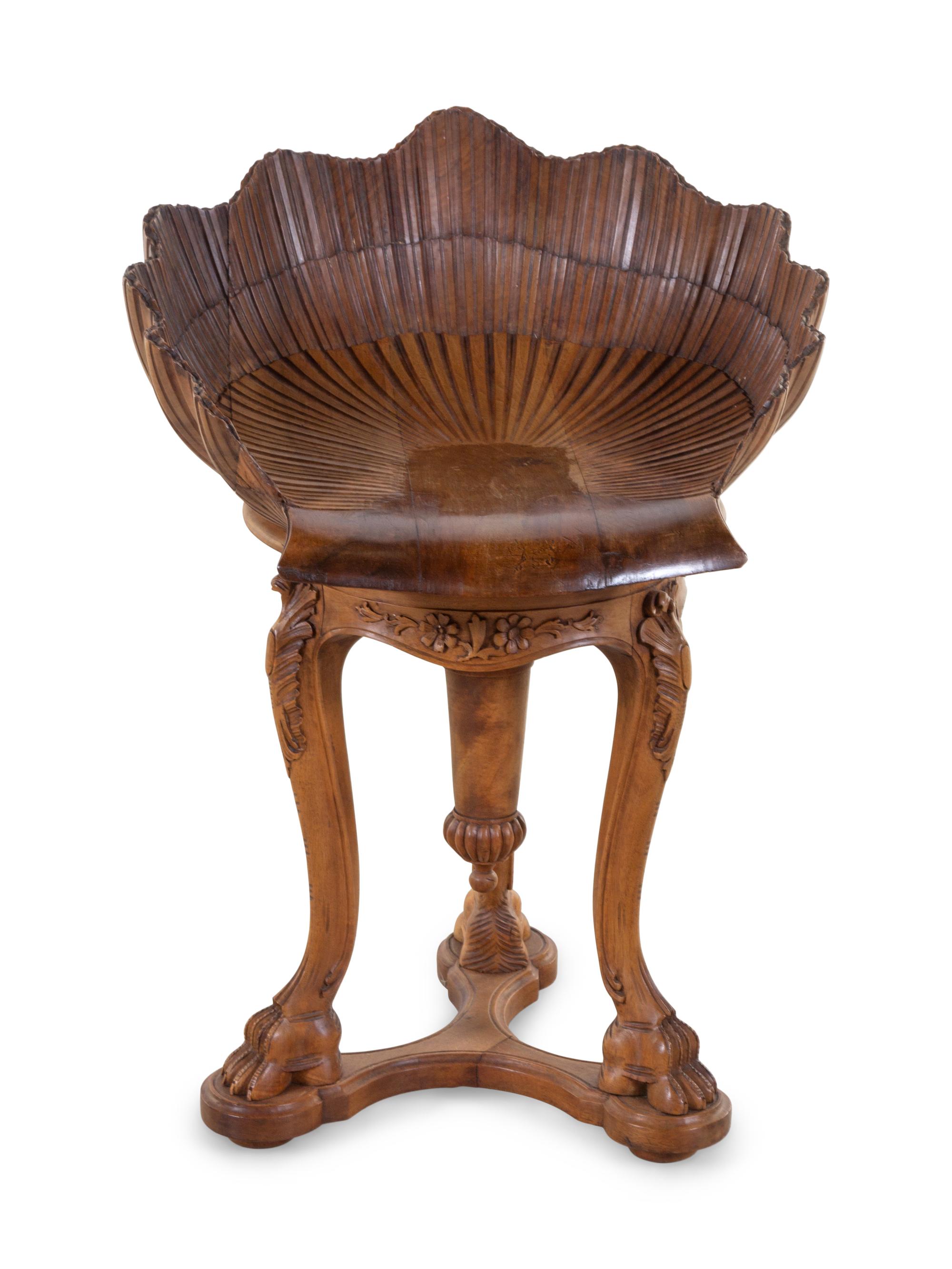 An Italian Grotto Style Carved Walnut Piano Stool