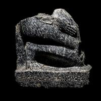 An Egyptian Gneiss Fragment of a Kneeling Figure