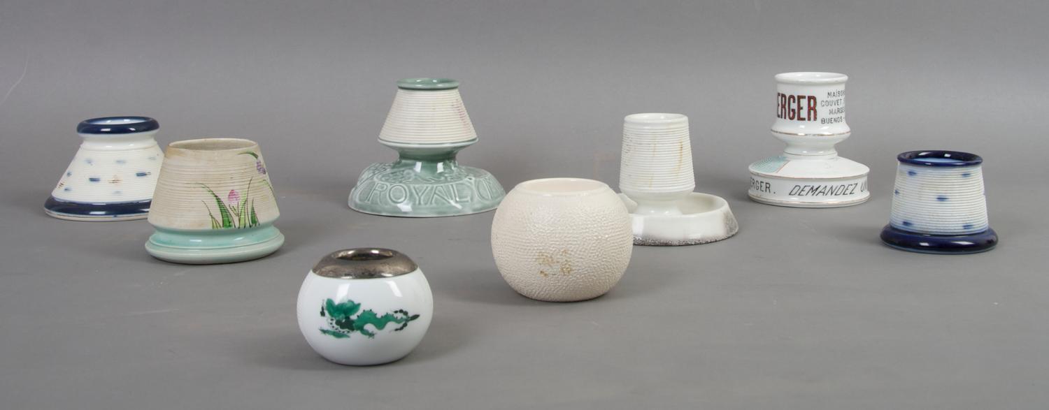 A Collection of Eight English and Continental Ceramic Match Strikes, Height of tallest 3 1/2 inches.