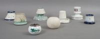 A Collection of Eight English and Continental Ceramic Match Strikes, Height of tallest 3 1/2 inches.