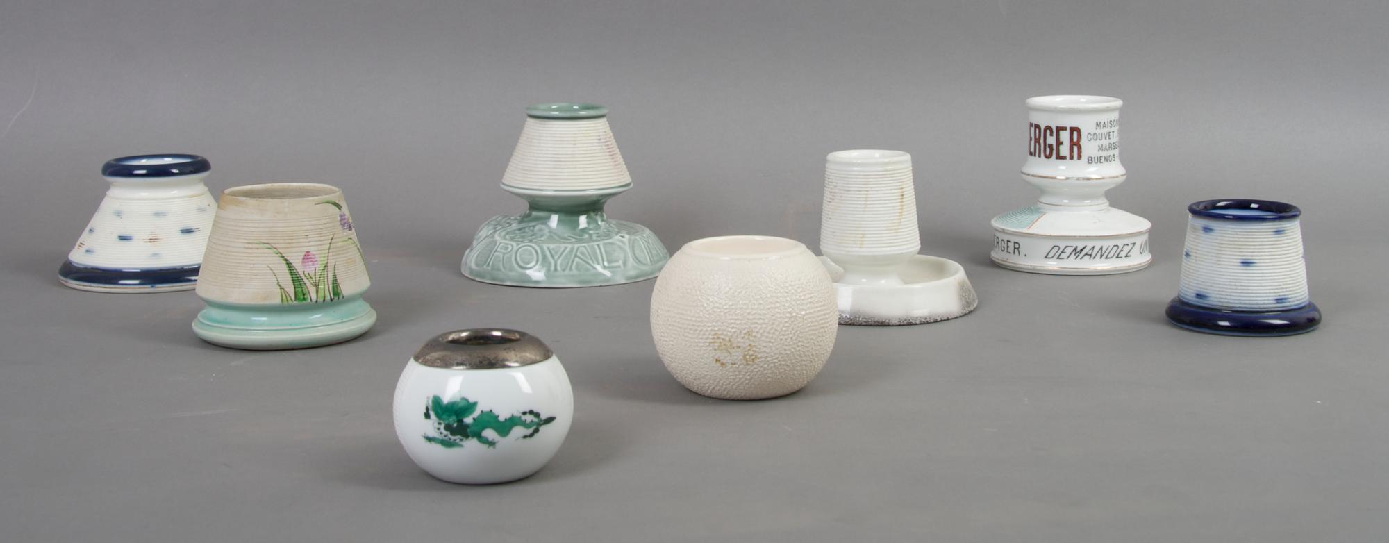A Collection of Eight English and Continental Ceramic Match Strikes, Height of tallest 3 1/2 inches.