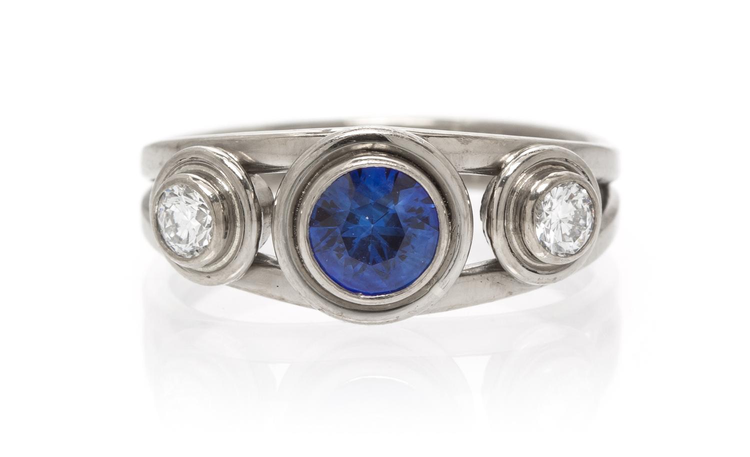 An 18 Karat White Gold, Sapphire and Diamond Ring, 2.90 dwts.