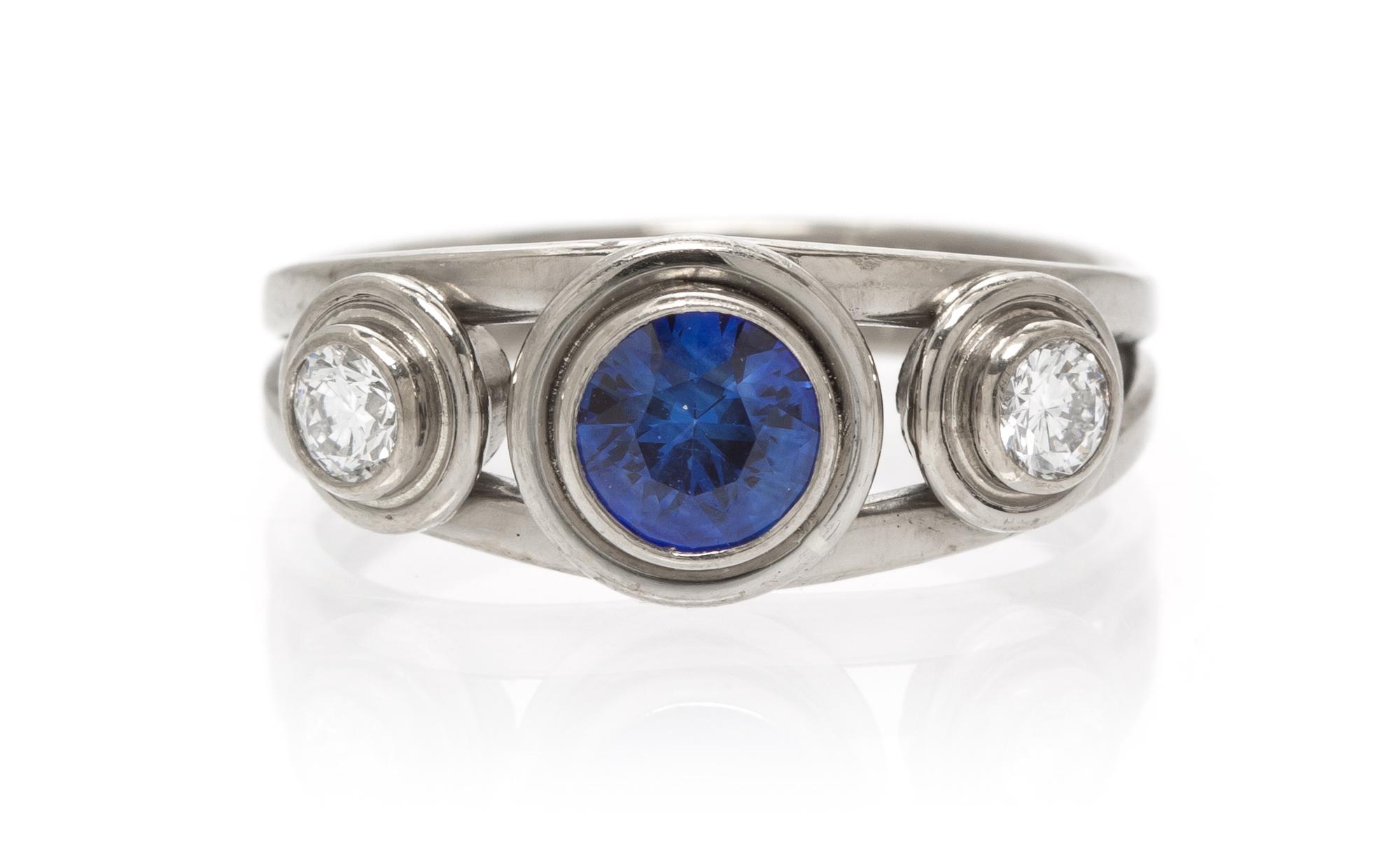 An 18 Karat White Gold, Sapphire and Diamond Ring, 2.90 dwts.