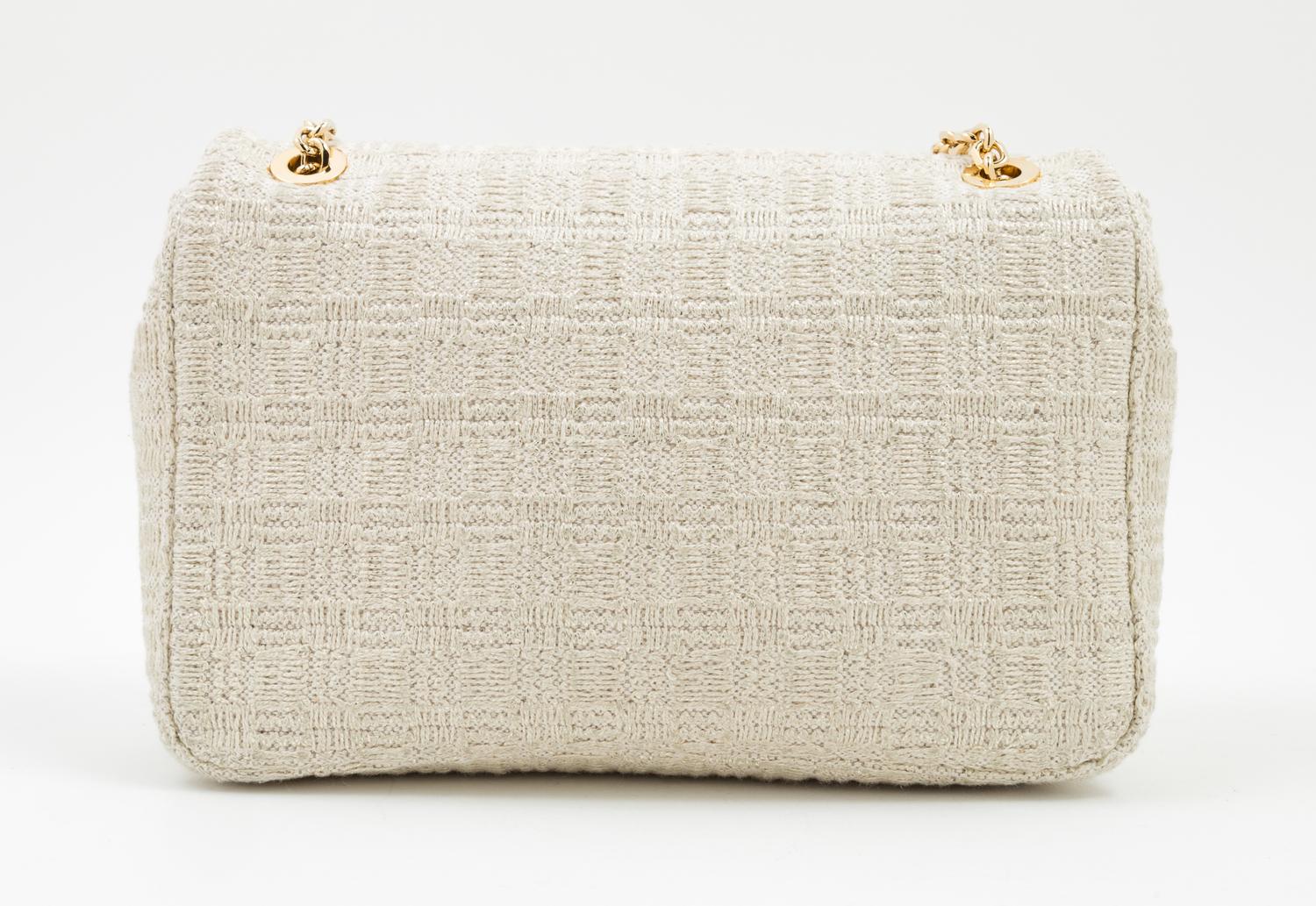 A Judith Leiber Cream Tweed Flap Handbag, 9.5" x 6.5" x 2.5".