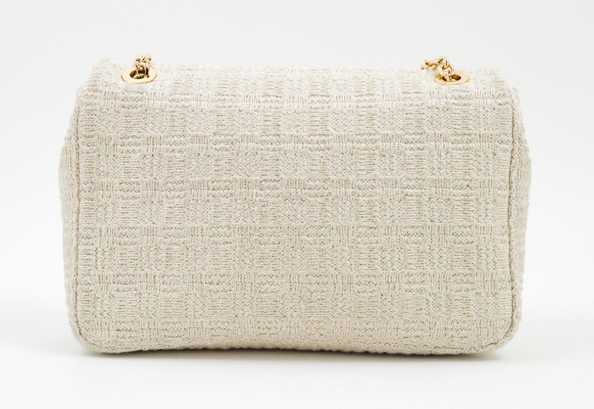A Judith Leiber Cream Tweed Flap Handbag, 9.5" x 6.5" x 2.5".