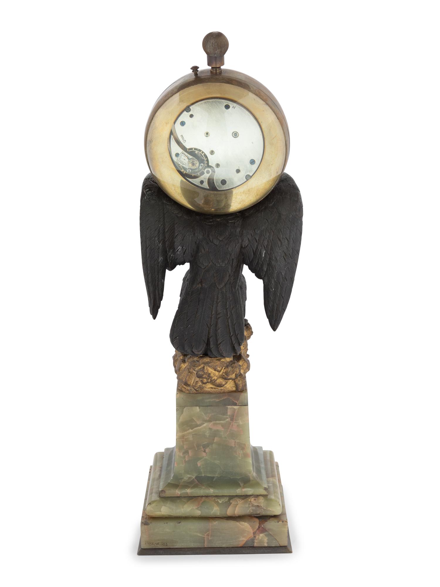 A Continental Gilt and Patinated Bronze and Onyx Clock