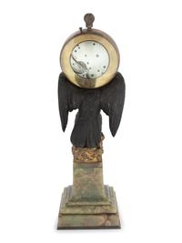 A Continental Gilt and Patinated Bronze and Onyx Clock