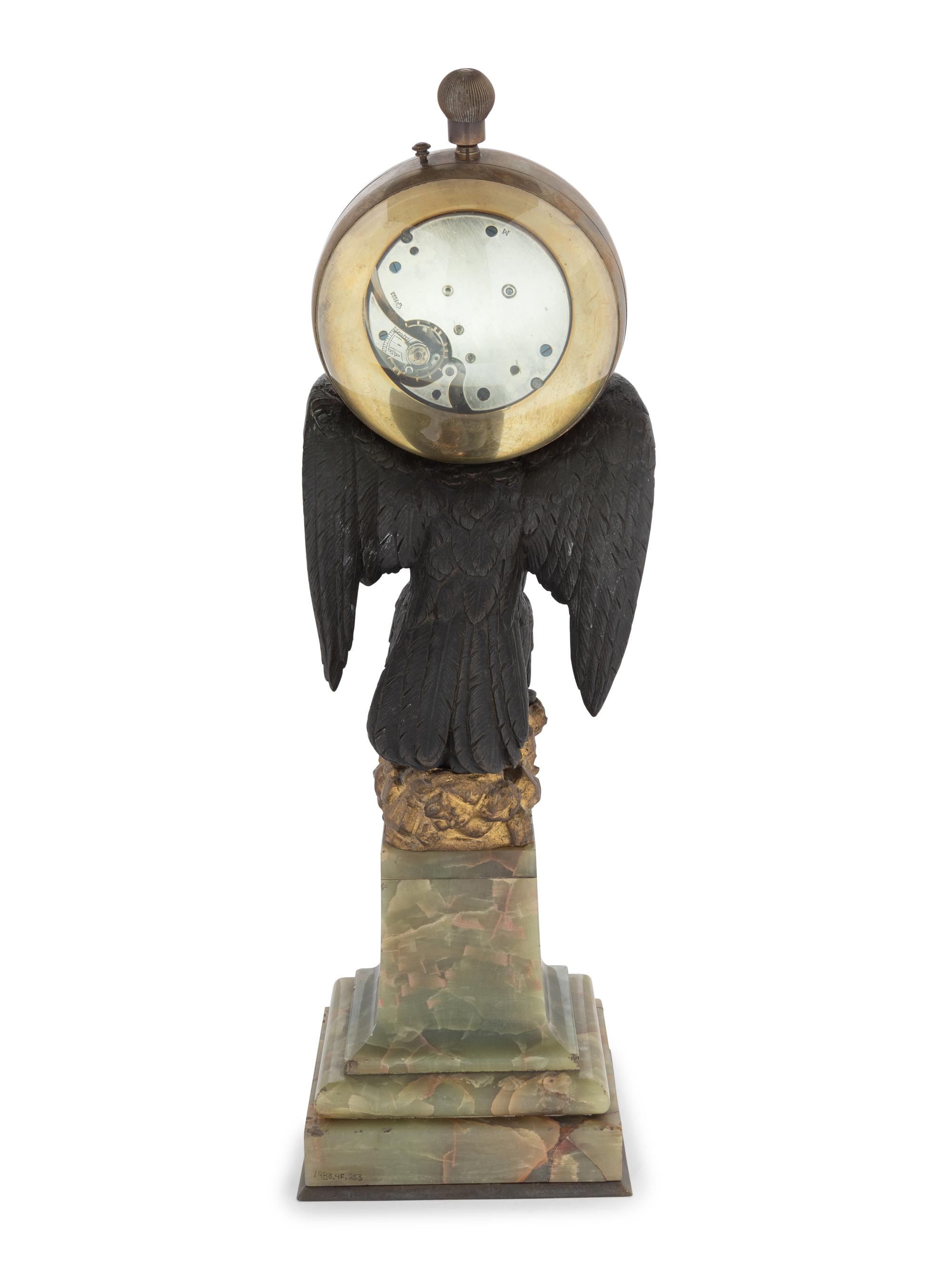 A Continental Gilt and Patinated Bronze and Onyx Clock