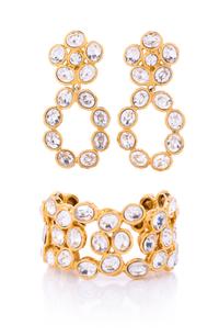 A Chanel Crystal and Goldtone Demi Parure, Cuff: 7" circumference; Earclips: 3" x 1.5".