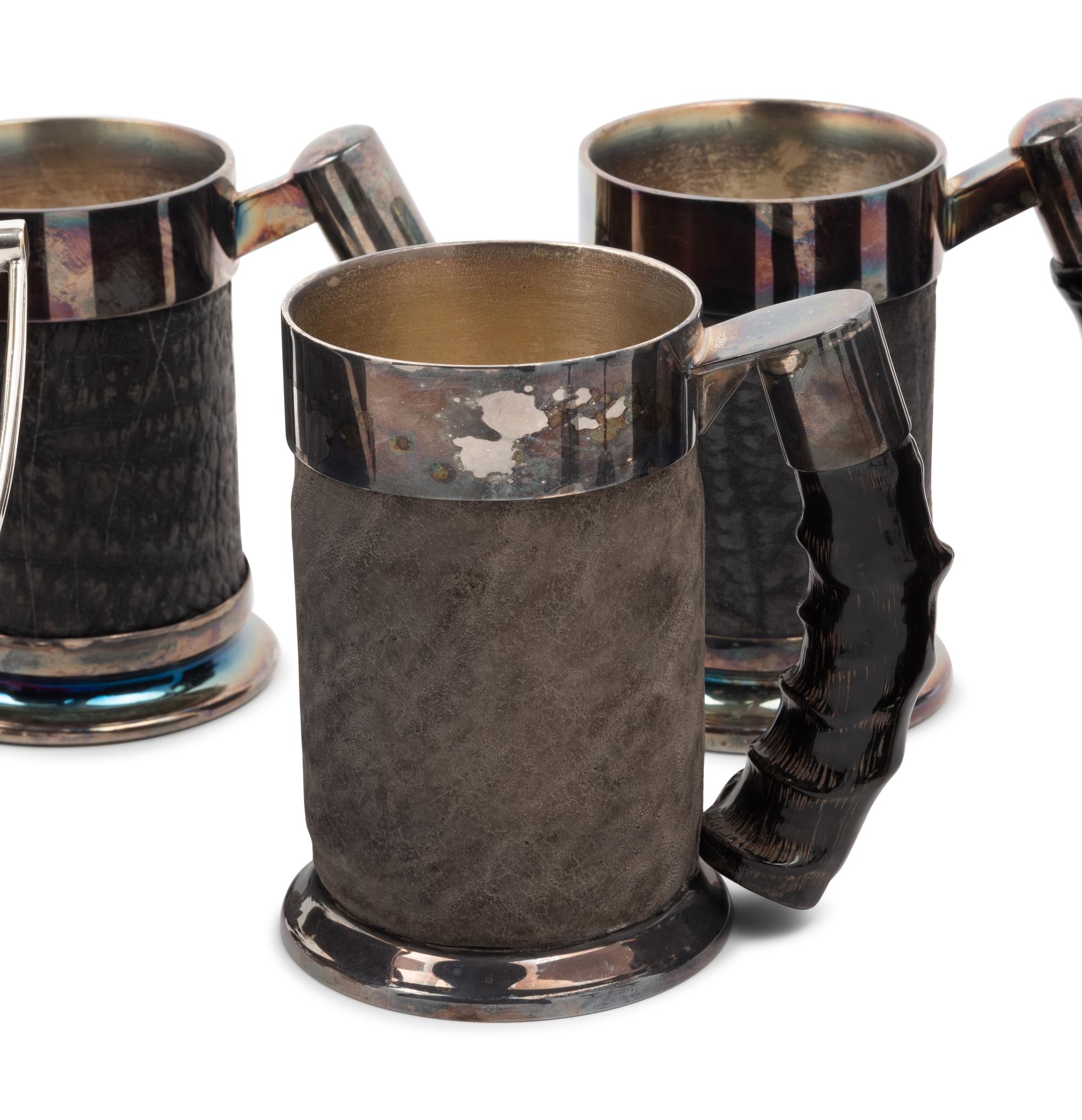 A Set of Silver-Plate and Hide Drinkware