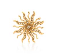 A 14 Karat Yellow Gold, Diamond, and Seed Pearl Sunburst Brooch, 6.80 dwts.