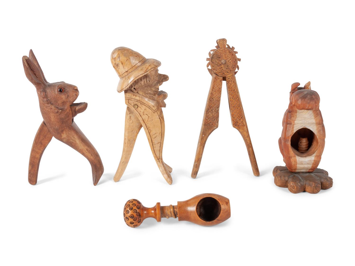 A Collection of Folk Art and Black Forest Carved Nut Crackers