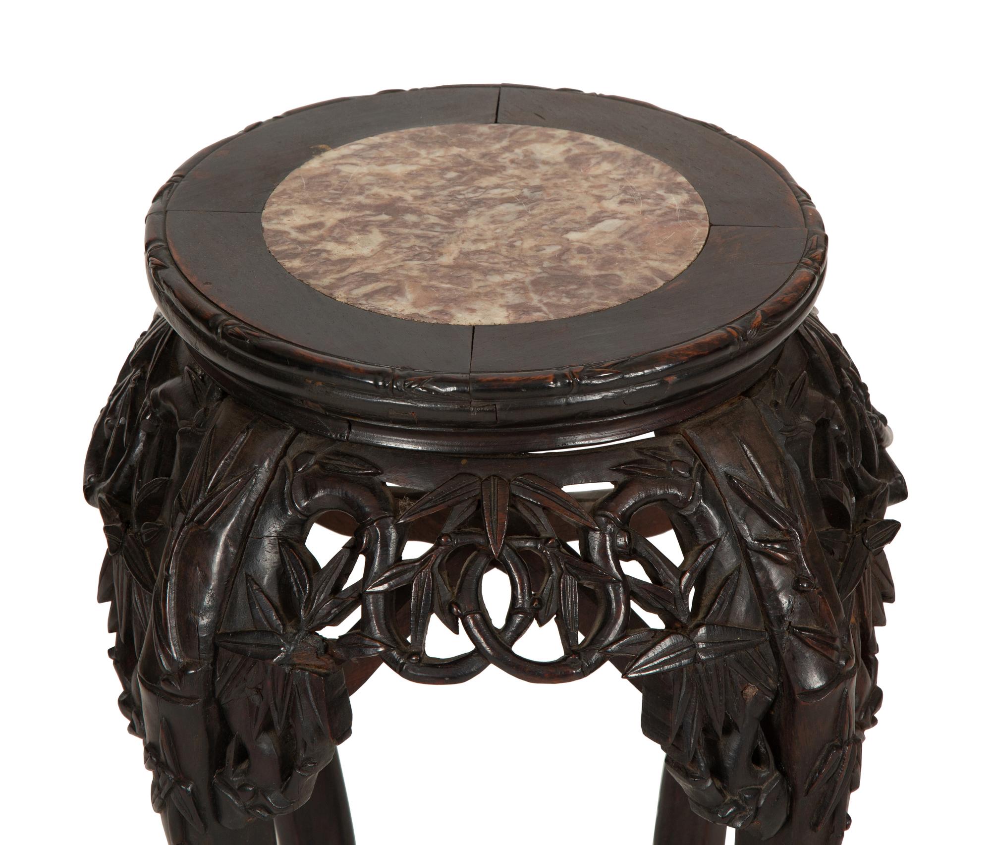 A Chinese Carved Hardwood Stand with Inset Marble Top