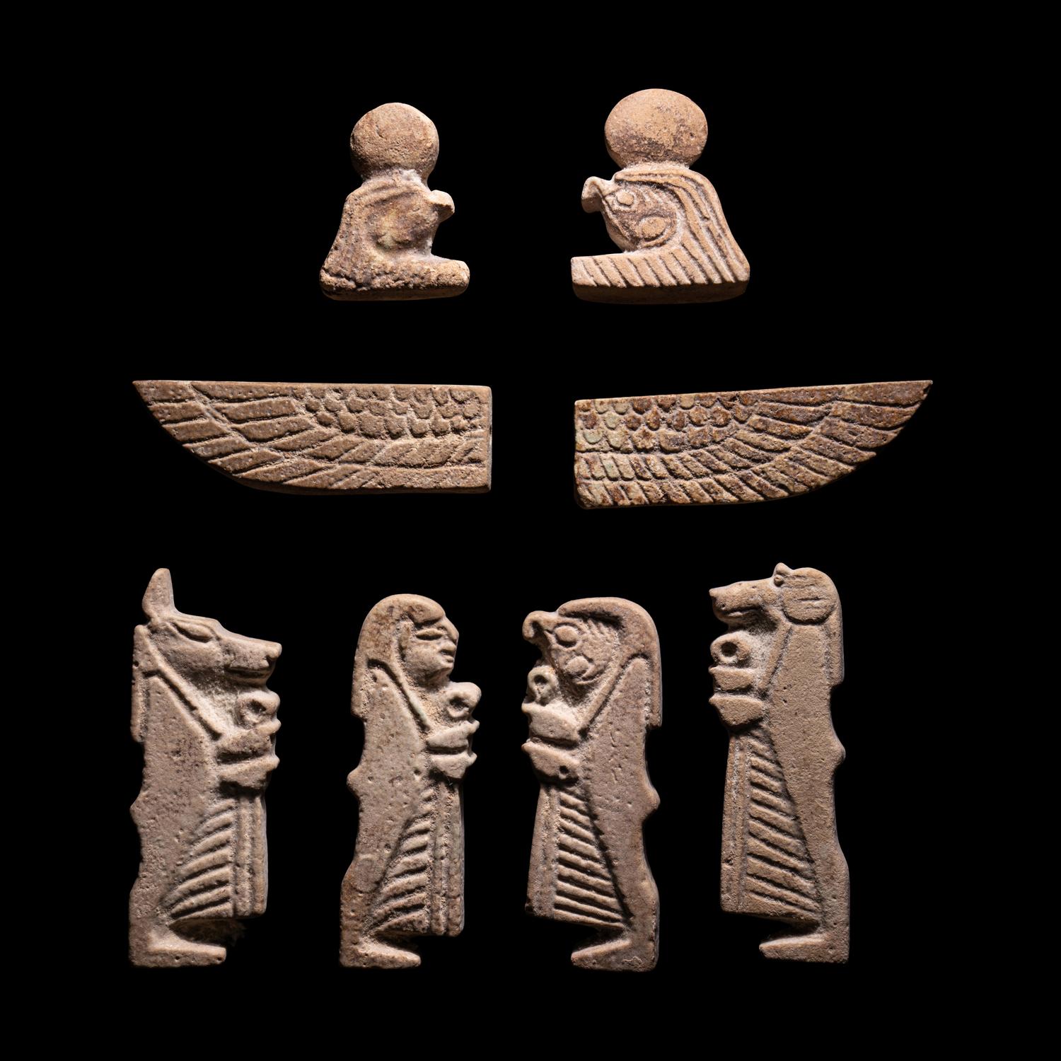 A Set of Four Sons of Horus, Two Scarab Wings, and Two Heads of Horus as a Falcon