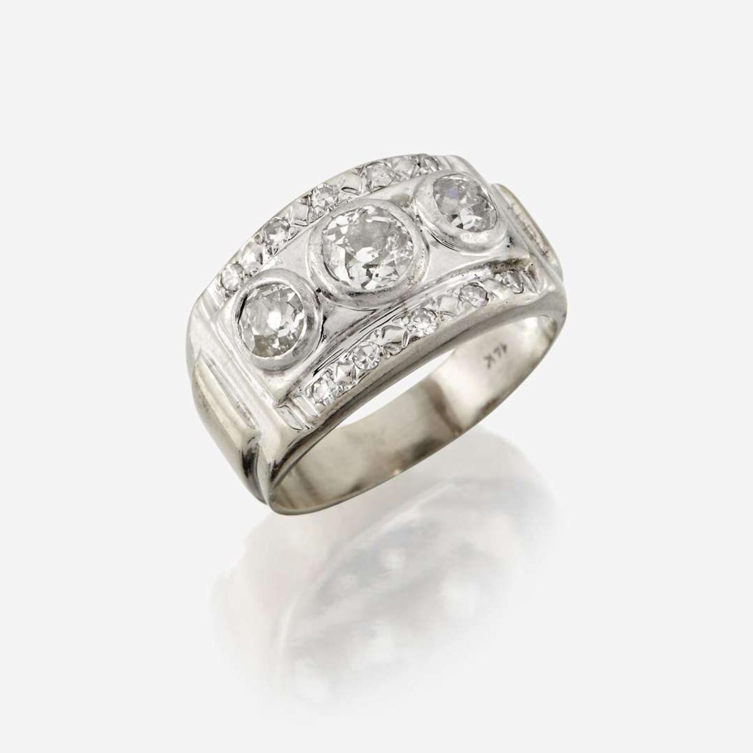 A diamond and fourteen karat gold ring