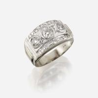 A diamond and fourteen karat gold ring
