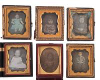 [EARLY PHOTOGRAPHY]. 23 ninth plate daguerreotypes of babies and toddlers.