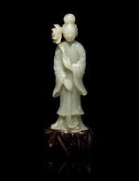 A Chinese Carved Pale Celadon Jade Standing Female Figure