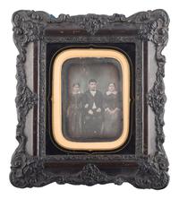 [EARLY PHOTOGRAPHY]. French half plate daguerreotype of a possible mixed race family housed in a wall frame. Lyon, n.d.