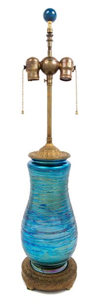 Durand, EARLY 20TH CENTURY, a glass table lamp, of baluster form with threaded decoration