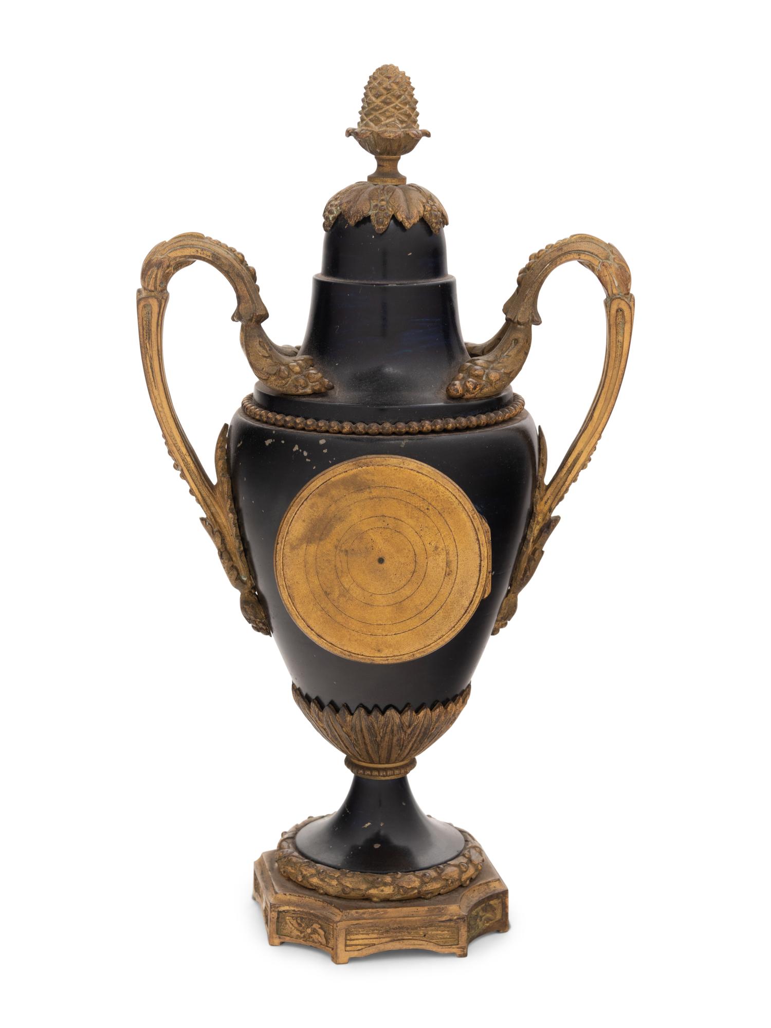 A French Gilt Bronze and Painted Tôle Clock