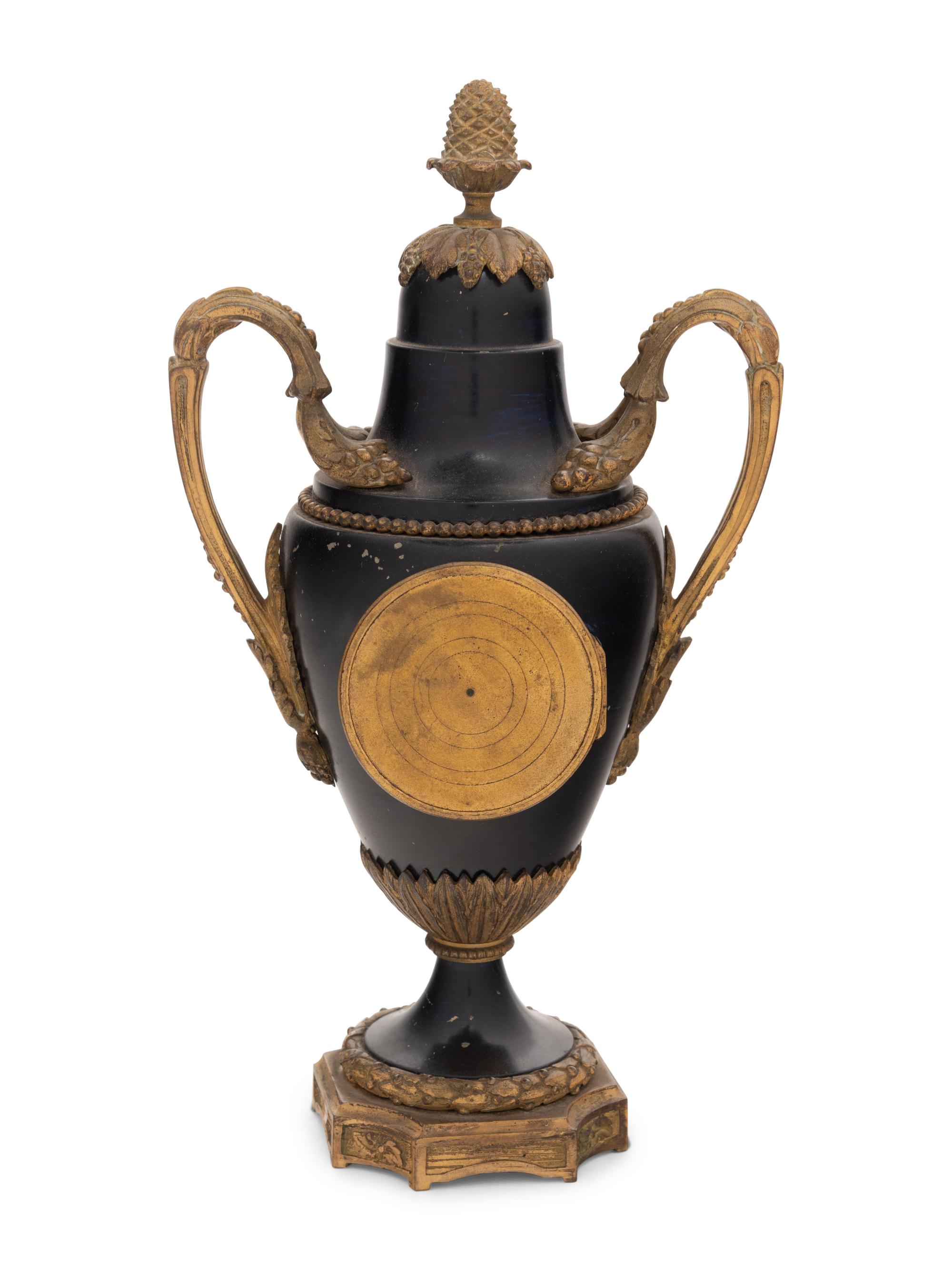 A French Gilt Bronze and Painted Tôle Clock