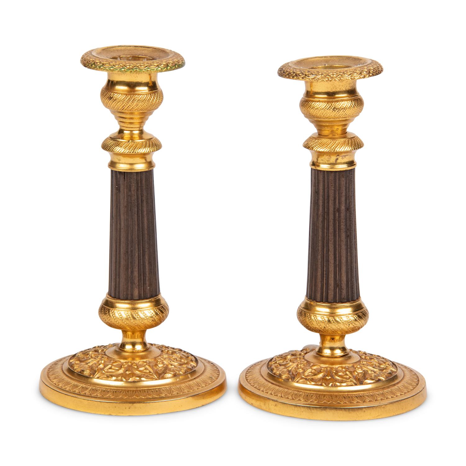 A Pair of Gilt Metal Mounted Candlesticks