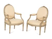 A Set of Four Louis XVI Grey-Painted and Parcel Gilt Fauteuils