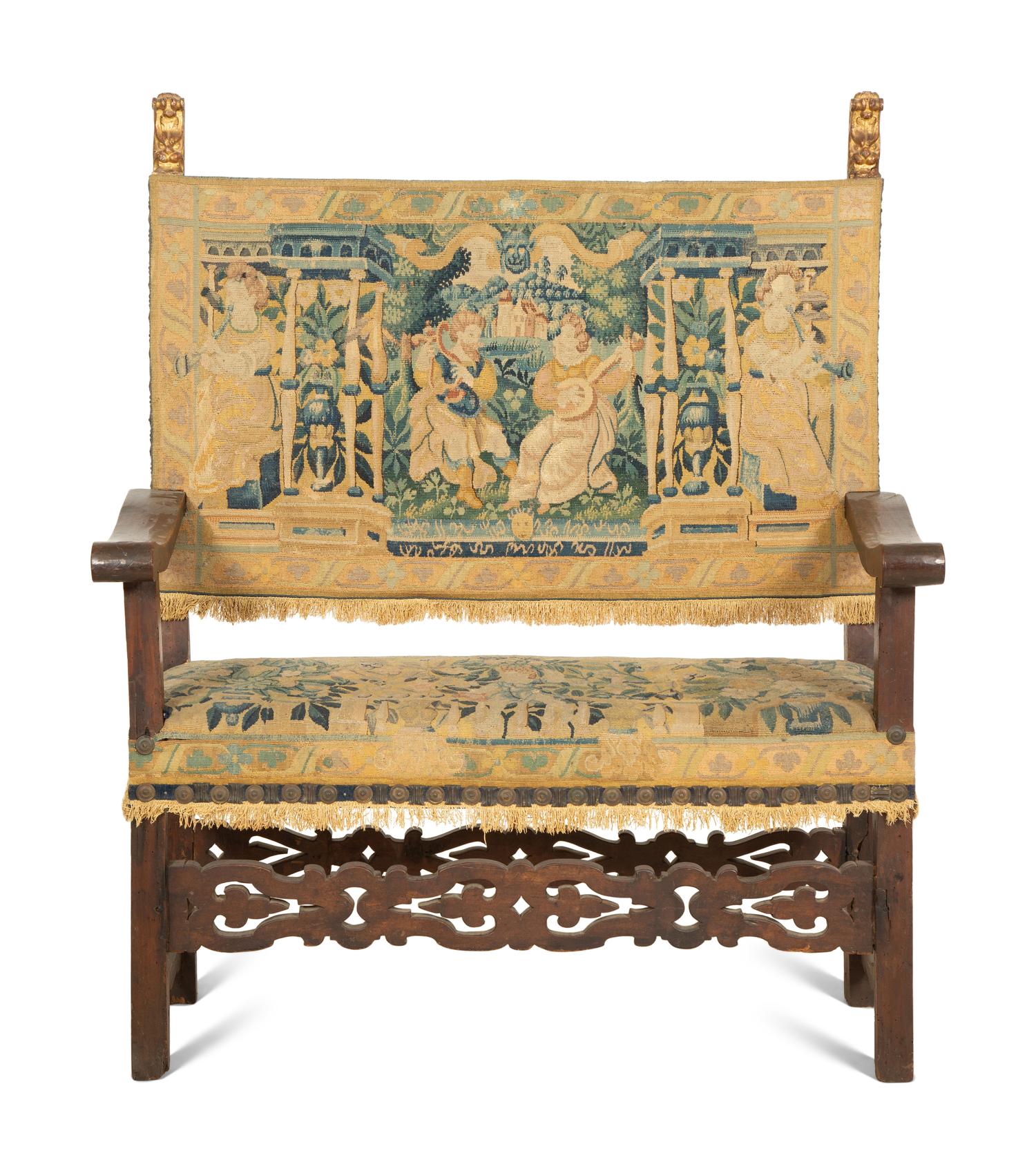 A Jacobean Style Walnut Bench with Tapestry Upholstery
