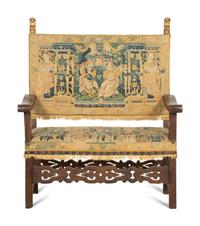 A Jacobean Style Walnut Bench with Tapestry Upholstery