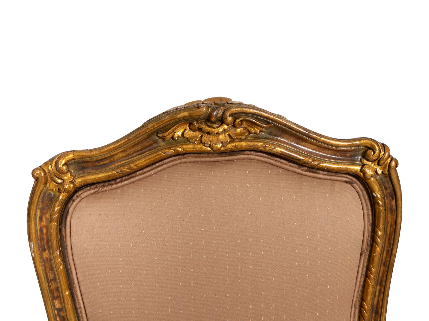 A Set of Four Louis XV Style Painted and Parcel Gilt Dining Chairs